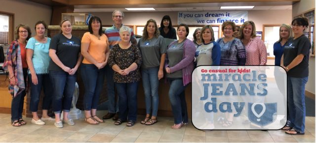 Group wearing jeans for Kansas Miracle Network